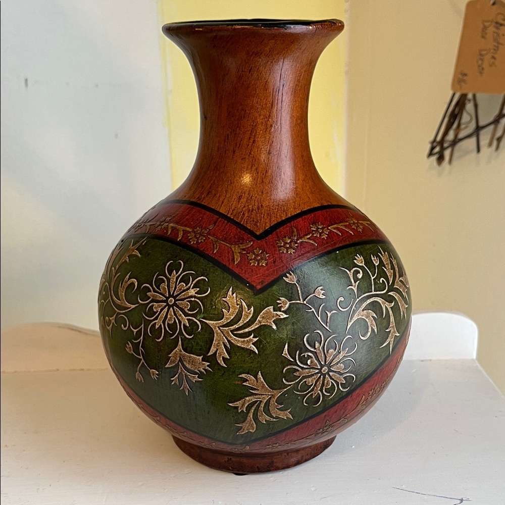Hand-carved terra cotta pottery vase with a floral inlay design